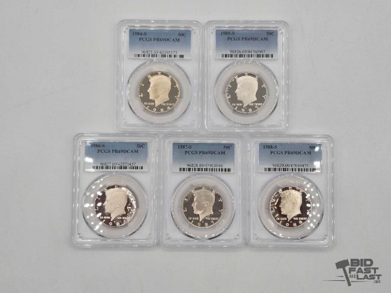 (5) 1984-1988 Graded Kennedy Half Dollars