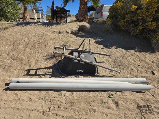 Wheelbarrow and 3 Pieces of 4in PVC Pipe