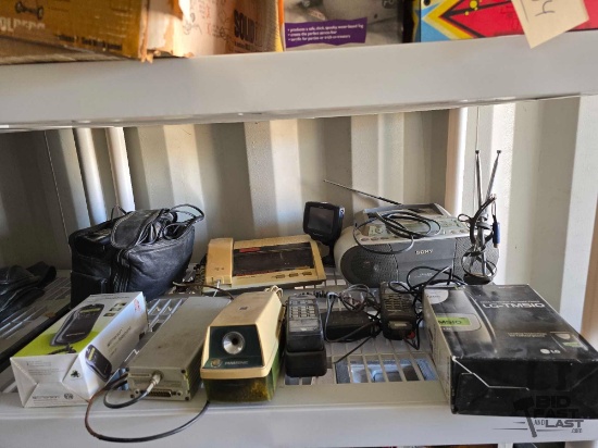 Magellan GPS, Emerson Slimline Telephone, LG-TM510 Cell Phone, JC Penny Telephone Clock Radio