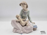 Lladro Dressing the Baby Porcelain Sculpture