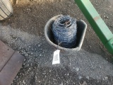 Roll Of Barb Wire and Bucket