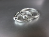 Two Same Style Sterling Silver Different Size Rings