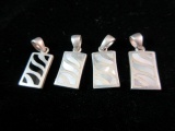 Lot of Four Sterling Silver Pendants