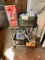 METAL ROLLING CART WITH (4) BOXES OF CAULKING AND ADHESIVE