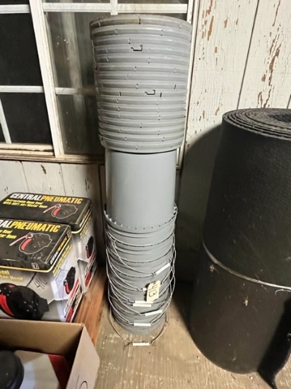 STACK OF PLASTIC BUCKETS WITH LIDS