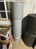 STACK OF PLASTIC BUCKETS WITH LIDS