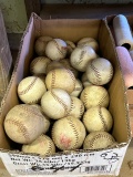 BOX OF SOFTBALLS