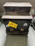 “Sweet Home Stove Works” double door wood-burning stove.