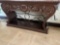 brown wooden cast iron hall table