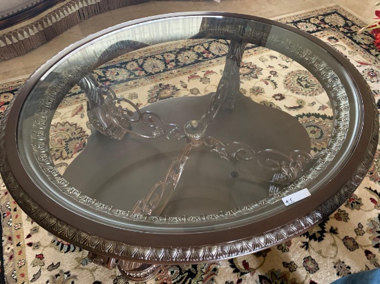 Oval dark wood stain coffee table, cast iron with glass top