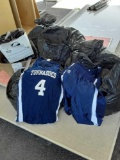 Group of bags with basketball uniforms