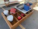 wooden cabinet, gas cans and trays