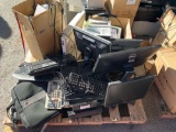 Pallet with monitors, keyboards, smart pens, laptop bags.