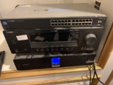 Entertainment system including, Linksys SLM2024, Yamaha Cinema DSP Digital with bass speaker, and a