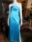Elegante vestido de noche color celeste metalizado con aplicaciones en bustoBrand: P'zazz Prom