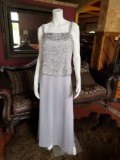 Beautiful gray party dress with applications on the bust.