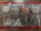 1980 U.S. proof set Uncirculated coins & 1989 United Kingdom Brilliant Uncirculated coin collection.