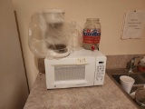 (1) GE Turntable Microwave Oven, (1) Coffee Pot, (1) Liquid Jug, (1) Plastic Gallon Jug