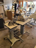 Optical Glass Cutting Machine, (2) Medical Instrument Tables, Slit Lamp, Box w/ Misc. Machines