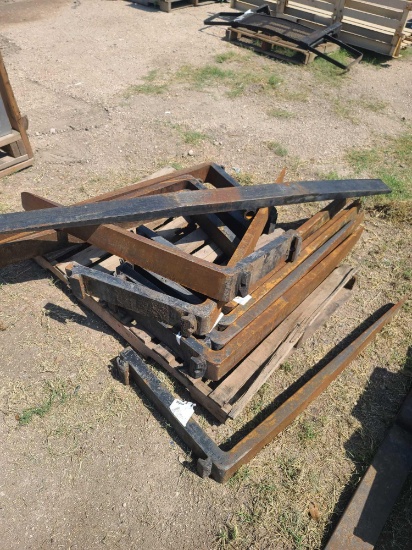Group of Fork Attachments on Pallet