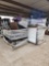 (2) Pallets w/ Student Desks, Stackable Student Chairs, (1) Mobile Ball Rack