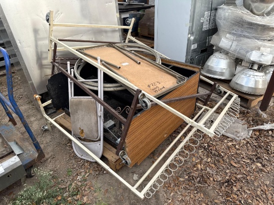Pallet w/ (1) Folding Table, (1) Folding Chair, (3) Clothing Racks, (1) Desk, Misc. Items