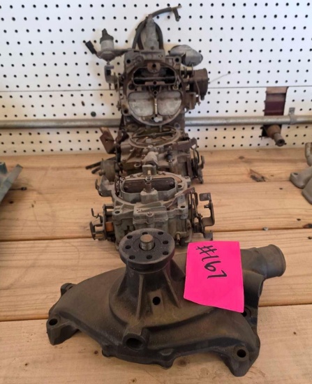 Vintage cast-iron mechanical engine water pump, Quadrajet 4-barrel carburetors,
