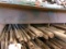 ROW OF METAL STOCK, ASST FLAT, ROUND, ANGLED