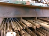 ROW OF METAL STOCK, ASST FLAT, ROUND, ANGLED