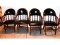 4 Black Vinyl Captains Chairs with Nail Head Trim