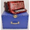 Red Accordion in Blue Case