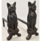 Pair Of Cast Iron Cat Irons green glass eyes