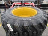 NEW (4) 12-16.5 Skid Steer Tires on New Holland Wheels