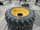 (4) 10-16.5 Skid Steer Tires on New Holland Wheels