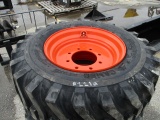 (4) 12-16.5 Skid Steer Tires on Bobcat Wheels