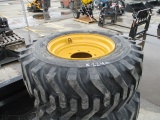 (4) 12-16.5 Skid Steer Tires on nEw Holland Wheels
