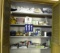 Four Shelves of Bath/Beauty Supplies And 12 Bed Sheets