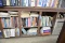 SIX CUBBY HOLES OF BOOKS  & MANALS