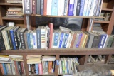 SHELF OF BOOKS AND TWO UPPER CUBBY HOLES