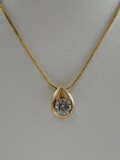 14 Karat Yellow Gold Teardrop Pendant with a .75 ct round LEO Diamond on a 14k gold snake chain