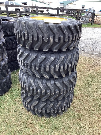 (4) 12-16.5 Skid Loader Tires on Yellow Rims