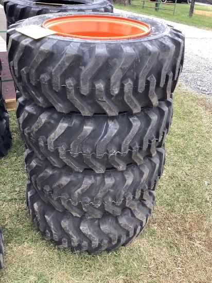(4) 10-16.5 Skid Loader tires on Orange Rims