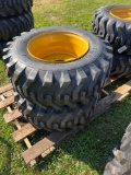 12-16.5 Skid Loader tires on wheels (CAT)