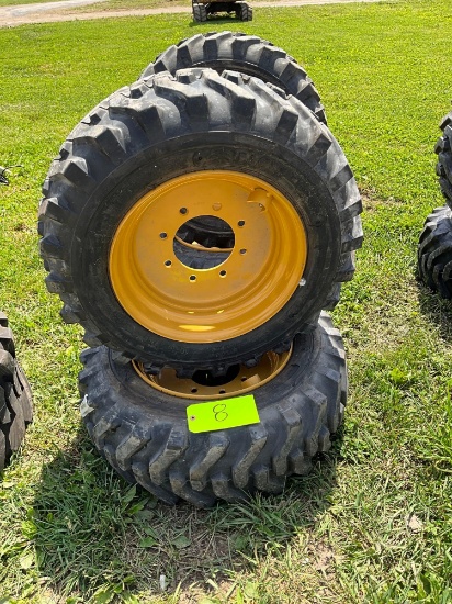Set of 4 - 10-16.5 Skid Loader Tires on wheels - CAT
