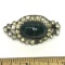 Antique Pin with Large Green Stone Surrounded by Clear Stones