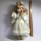 Porcelain Doll with Blonde Hair & Blue Eyes on Stand