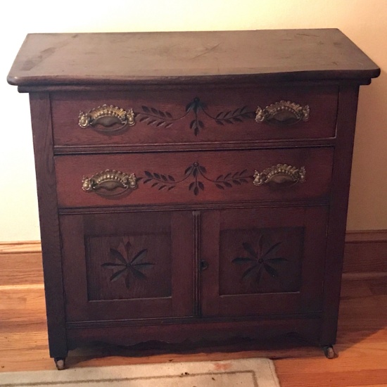 Antique 2 Drawer Wash Stand with Pennsylvania Dutch Style Carvings in Doors & Drawers on Casters
