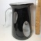 Large Black Art Glass Pitcher with White Interior & Clear Handle
