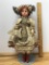 Antique Doll with Soft Body on Stand