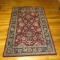 Oriental Style Area Rug with Wine Background with Blue/Cream/Gold Patterns